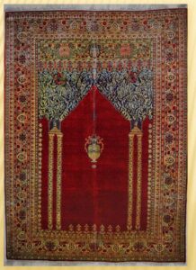 A carpet or rug with an altar design